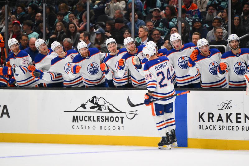 Oct 2, 2024; Seattle, Washington, USA; Edmonton Oilers defenseman Travis Dermott (24) celebrates after scoring a goal against the Seattle Kraken during the second period at Climate Pledge Arena. Mandatory Credit: Steven Bisig-Imagn Images