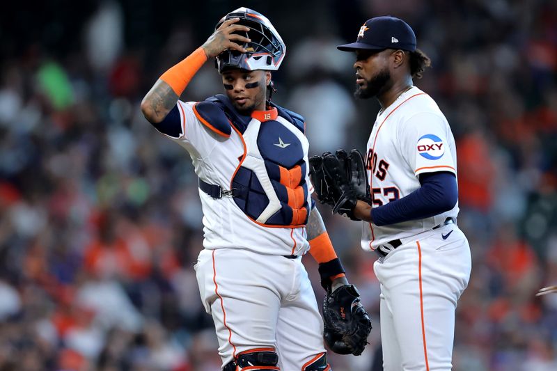 Apr 29, 2023; Houston, Texas, USA; Houston Astros catcher Martin Maldonado (15) talks with starting pitcher Cristian Javier (53) during the fourth inning against the Philadelphia Phillies at Minute Maid Park. Mandatory Credit: Erik Williams-USA TODAY Sports