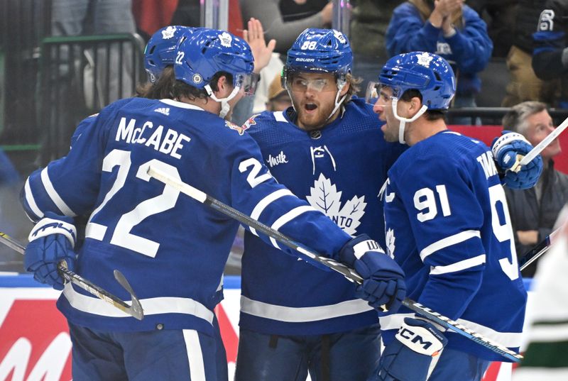 Oct 14, 2023; Toronto, Ontario, CAN;   Toronto Maple Leafs forward William Nylander (88) celebrates with teammates after scoring a goal against the Minnesota Wild in the first period at Scotiabank Arena. Mandatory Credit: Dan Hamilton-USA TODAY Sports