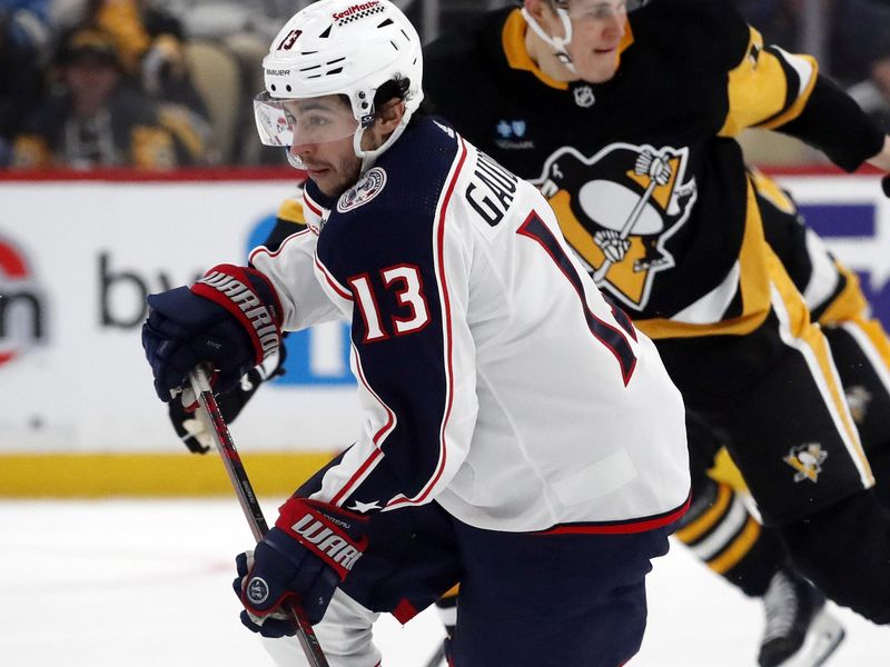 Mar 5, 2024; Pittsburgh, Pennsylvania, USA; Columbus Blue Jackets left wing Johnny Gaudreau (13) handles the puck the against the Pittsburgh Penguins during the second  period at PPG Paints Arena. The Penguins won 5-3. Mandatory Credit: Charles LeClaire-USA TODAY Sports