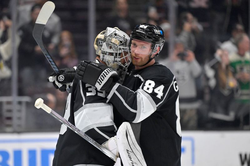 Apr 11, 2024; Los Angeles, California, USA; Los Angeles Kings defenseman Vladislav Gavrikov (84) congratulates goaltender Cam Talbot (39) after defeating the Calgary Flames at Crypto.com Arena. Mandatory Credit: Jayne Kamin-Oncea-USA TODAY Sports