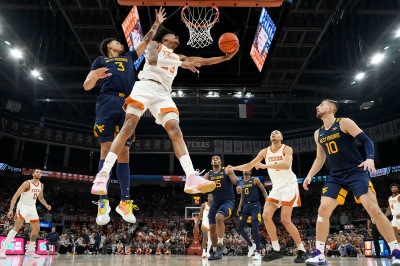 Feb 11, 2023; Austin, Texas, USA; Texas Longhorns forward Dillon Mitchell (23) shoots around West Virginia Mountaineers forward Tre Mitchell (3) during the second half at Moody Center. Mandatory Credit: Scott Wachter-USA TODAY Sports