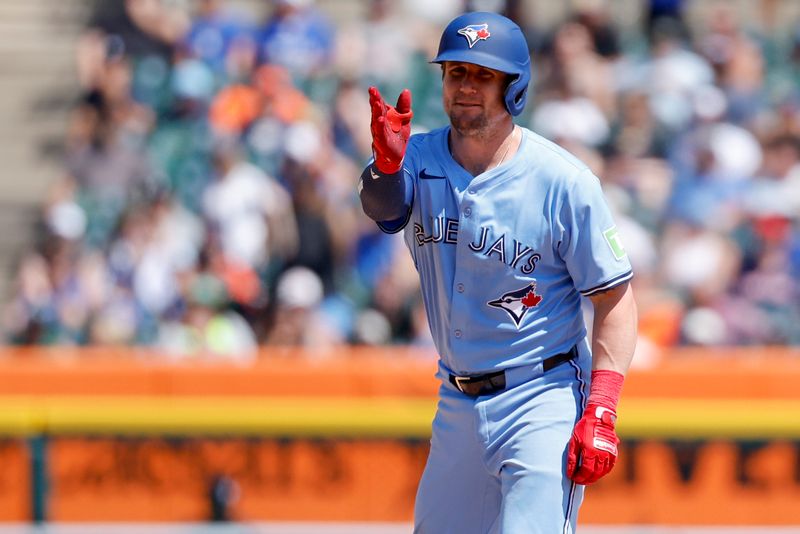 Jul 27, 2025; Detroit, Michigan, USA;  Toronto Blue Jays catcher Tyler Heineman (55) celebrates after hitting a double in the seventh inning against the Detroit Tigers at Comerica Park. Mandatory Credit: Rick Osentoski-Imagn Images