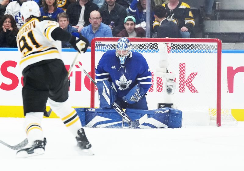 Nov 5, 2024; Toronto, Ontario, CAN; Toronto Maple Leafs goaltender Anthony Stolarz (41) stops the puck shot by Boston Bruins defenseman Nikita Zadorov (91) during the third period at Scotiabank Arena. Mandatory Credit: Nick Turchiaro-Imagn Imagess