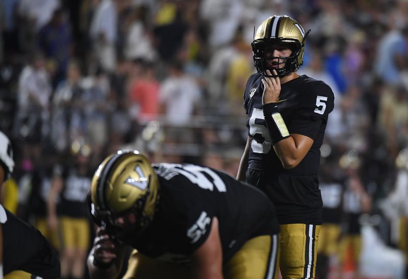 Aug 26, 2023; Nashville, Tennessee, USA; Vanderbilt Commodores quarterback AJ Swann (5) calls a play at the line during the first half against the Hawaii Warriors at FirstBank Stadium. Mandatory Credit: Christopher Hanewinckel-USA TODAY Sports