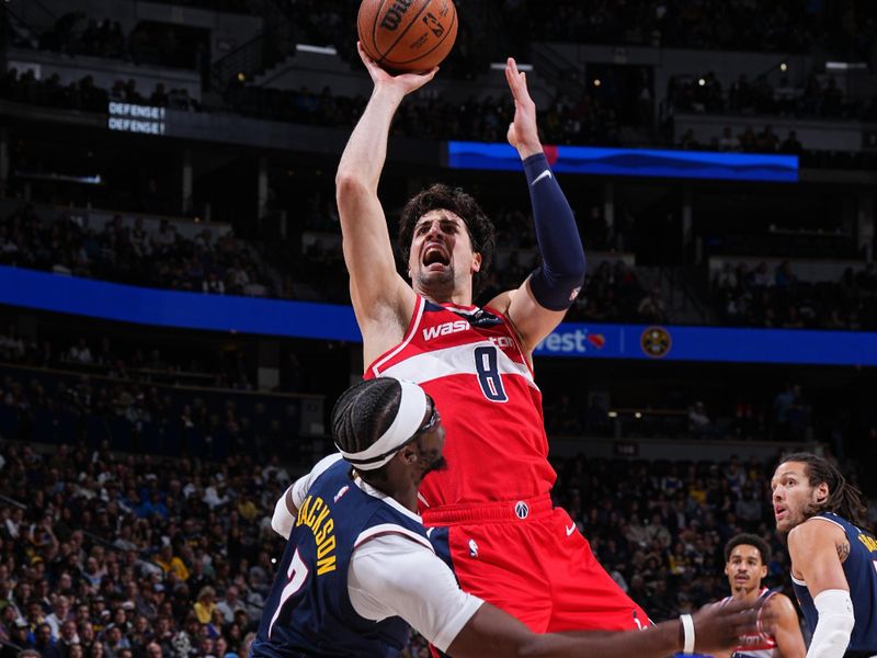 DENVER, CO - FEBRUARY 22: Deni Avdija #8 of the Washington Wizards drives to the basket during the game against the Denver Nuggets on February 22, 2024 at the Ball Arena in Denver, Colorado. NOTE TO USER: User expressly acknowledges and agrees that, by downloading and/or using this Photograph, user is consenting to the terms and conditions of the Getty Images License Agreement. Mandatory Copyright Notice: Copyright 2024 NBAE (Photo by Garrett Ellwood/NBAE via Getty Images)