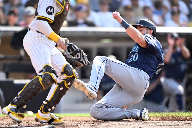 Jul 10, 2024; San Diego, California, USA; Seattle Mariners right fielder Luke Raley (20) slides home to score a run against the San Diego Padres during the fourth inning at Petco Park. Mandatory Credit: Orlando Ramirez-USA TODAY Sports