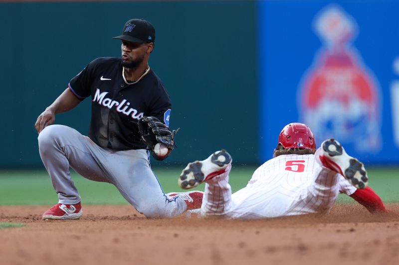 Aug 14, 2024; Philadelphia, Pennsylvania, USA; Philadelphia Phillies second base Bryson Stott (5) steals second base past Miami Marlins second base Otto Lopez (61) during the second inning at Citizens Bank Park. Mandatory Credit: Bill Streicher-USA TODAY Sports