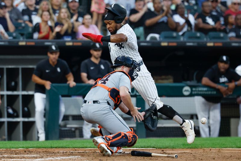 Aug 24, 2024; Chicago, Illinois, USA; Chicago White Sox outfielder Corey Julks (30) scores against the Detroit Tigers during the third inning at Guaranteed Rate Field. Mandatory Credit: Kamil Krzaczynski-USA TODAY Sports