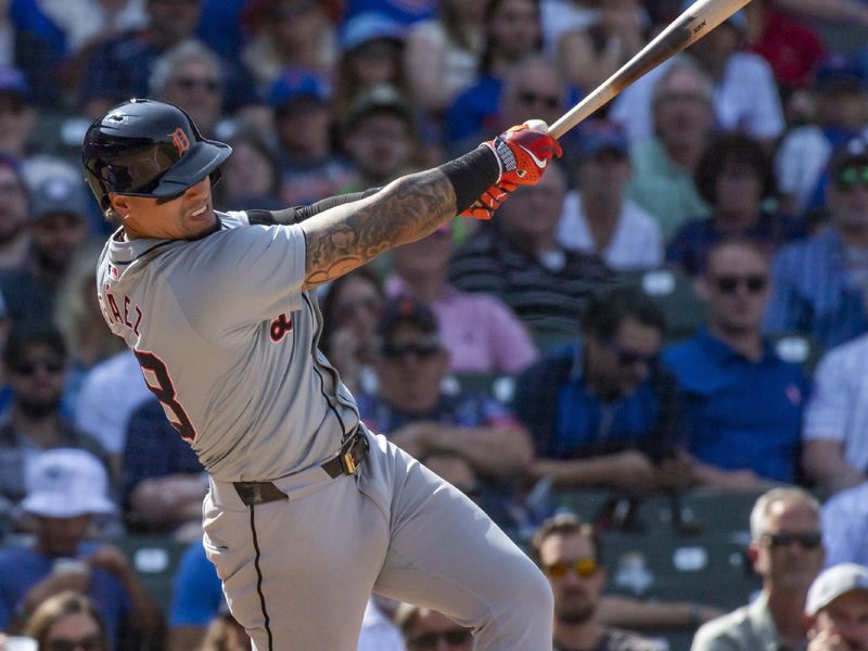 Aug 22, 2024; Chicago, Illinois, USA; Detroit Tigers shortstop Javier Baez (28) singles during the eighth inning against the Chicago Cubs at Wrigley Field. Mandatory Credit: Patrick Gorski-USA TODAY Sports