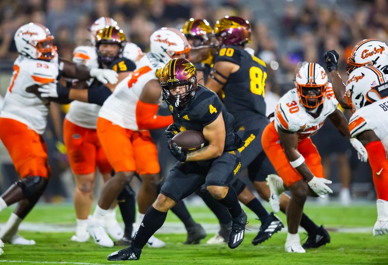 Sep 9, 2023; Tempe, Arizona, USA; Arizona State Sun Devils running back Cameron Skattebo (4) against the Oklahoma State Cowboys in the first half at Mountain America Stadium. Mandatory Credit: Mark J. Rebilas-USA TODAY Sports