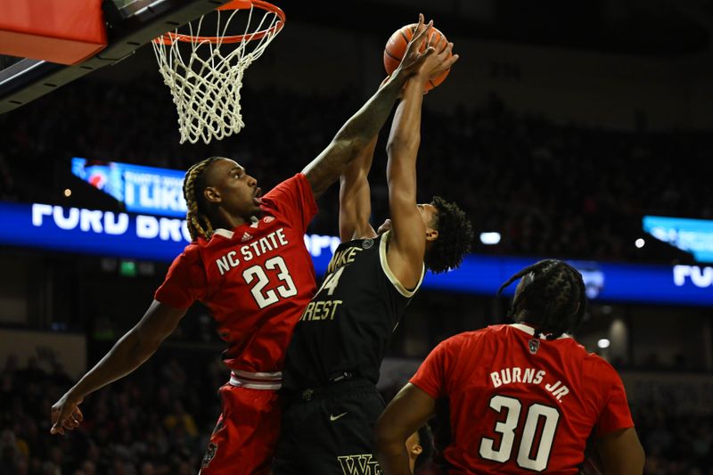 Jan 28, 2023; Winston-Salem, North Carolina, USA;   North Carolina State Wolfpack forward Greg Gantt (23) blocks the shot from Wake Forest Demon Deacons forward Bobi Klintman (34) during the first half at Lawrence Joel Veterans Memorial Coliseum. Mandatory Credit: William Howard-USA TODAY Sports