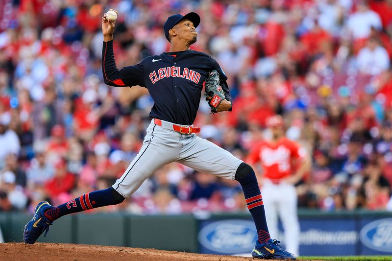 Jun 11, 2024; Cincinnati, Ohio, USA; Cleveland Guardians starting pitcher Triston McKenzie (24) pitches against the Cincinnati Reds in the first inning at Great American Ball Park. Mandatory Credit: Katie Stratman-USA TODAY Sports