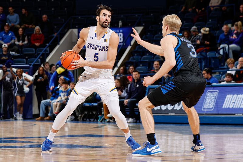 Jan 13, 2024; Colorado Springs, Colorado, USA; San Jose State Spartans forward Tibet Gorener (5) controls the ball as Air Force Falcons forward Luke Kearney (3) guards in the first half at Clune Arena. Mandatory Credit: Isaiah J. Downing-USA TODAY Sports