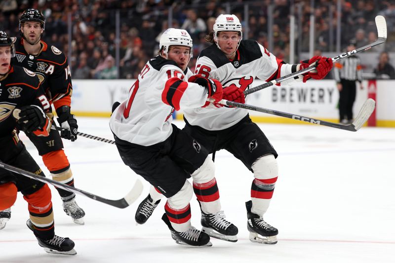 Mar 1, 2024; Anaheim, California, USA; New Jersey Devils right wing Alexander Holtz (10) and left wing Erik Haula (56) reacts to the puck during the third period against the Anaheim Ducks at Honda Center. Mandatory Credit: Kiyoshi Mio-USA TODAY Sports