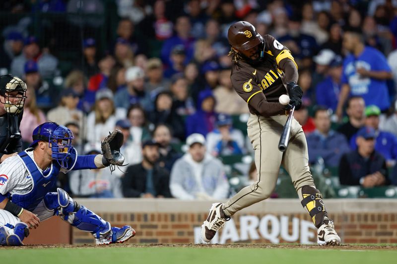 May 6, 2024; Chicago, Illinois, USA; San Diego Padres outfielder Fernando Tatis Jr. (23) singles against the Chicago Cubs during the sixth inning at Wrigley Field. Mandatory Credit: Kamil Krzaczynski-USA TODAY Sports