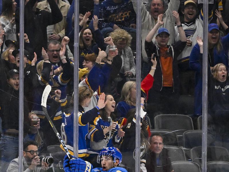 Dec 23, 2023; St. Louis, Missouri, USA;  St. Louis Blues center Jordan Kyrou (25) reacts after scoring against the Chicago Blackhawks during the third period at Enterprise Center. Mandatory Credit: Jeff Curry-USA TODAY Sports