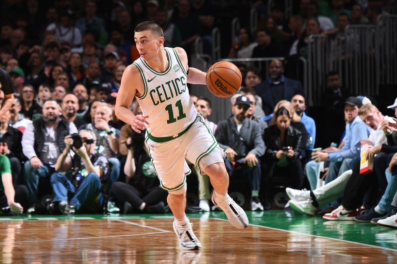 BOSTON, MA - APRIL 11: Payton Pritchard #11 of the Boston Celtics dribbles the ball during the game against the New York Knicks on April 11, 2024 at the TD Garden in Boston, Massachusetts. NOTE TO USER: User expressly acknowledges and agrees that, by downloading and or using this photograph, User is consenting to the terms and conditions of the Getty Images License Agreement. Mandatory Copyright Notice: Copyright 2024 NBAE  (Photo by Brian Babineau/NBAE via Getty Images)