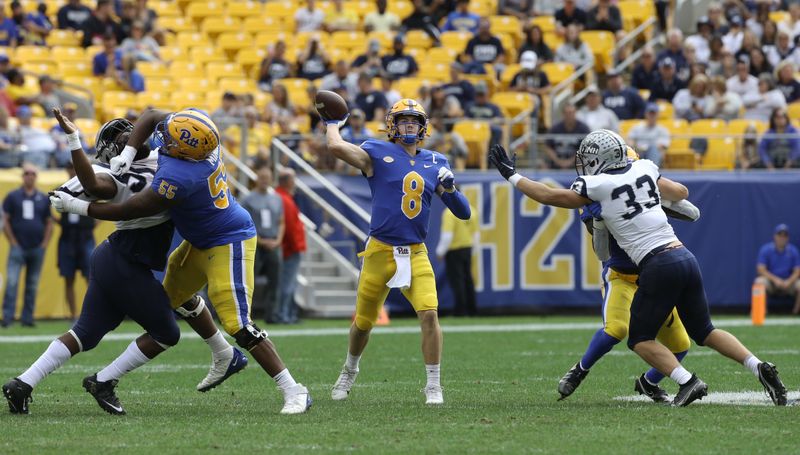 Sep 25, 2021; Pittsburgh, Pennsylvania, USA;  Pittsburgh Panthers quarterback Kenny Pickett (8) passes the ball against the New Hampshire Wildcats during the first quarter at Heinz Field. Mandatory Credit: Charles LeClaire-USA TODAY Sports