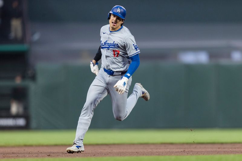 May 15, 2024; San Francisco, California, USA; Los Angeles Dodgers designated hitter Shohei Ohtani (17) runs to third base against the San Francisco Giants during the fifth inning at Oracle Park. Mandatory Credit: John Hefti-USA TODAY Sports