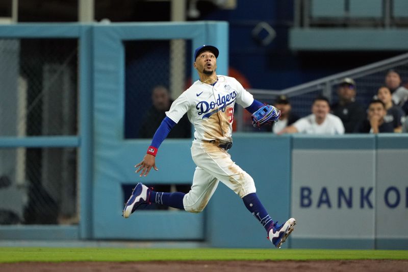 Jun 2, 2023; Los Angeles, California, USA; Los Angeles Dodgers right fielder Mookie Betts (50) pursues a fly ball against the New York Yankees at Dodger Stadium. Mandatory Credit: Kirby Lee-USA TODAY Sports