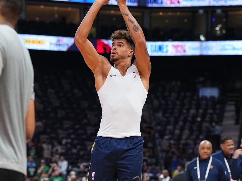 ABU DHABI, UAE - OCTOBER 6: Michael Porter Jr. #1 of the Denver Nuggets warms up before the game against the Boston Celtics during the 2024 Global Games on October 6, 2024 at the Etihad Arena in Abu Dhabi, United Arab Emirates. NOTE TO USER: User expressly acknowledges and agrees that, by downloading and/or using this Photograph, user is consenting to the terms and conditions of the Getty Images License Agreement. Mandatory Copyright Notice: Copyright 2024 NBAE (Photo by Garrett Ellwood/NBAE via Getty Images)