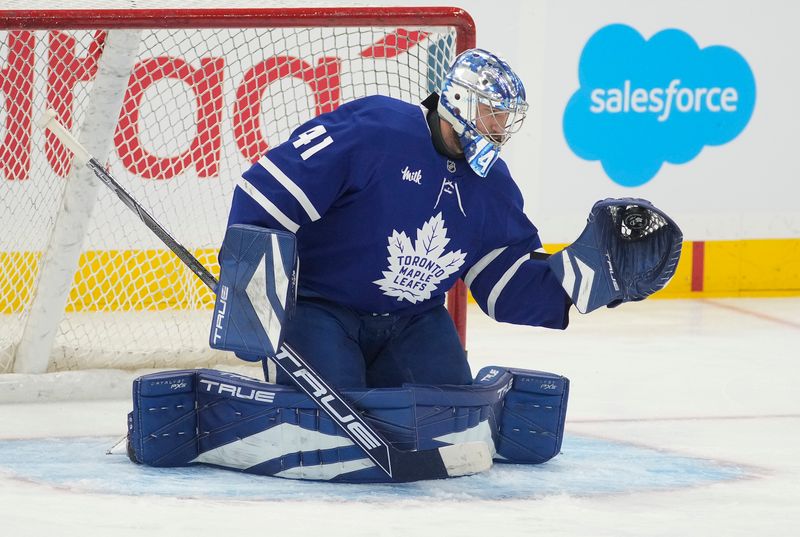 Oct 21, 2024; Toronto, Ontario, CAN; Toronto Maple Leafs goaltender Anthony Stolarz (41) makes a save during warm-up before a game against the Tampa Bay Lightning at Scotiabank Arena. Mandatory Credit: John E. Sokolowski-Imagn Images