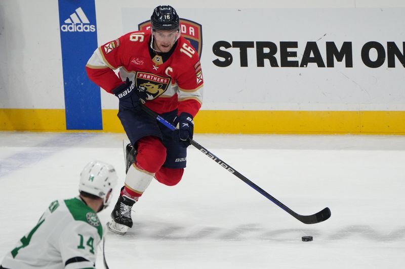 Dec 6, 2023; Sunrise, Florida, USA; Florida Panthers center Aleksander Barkov (16) brings the puck up the ice as Dallas Stars left wing Jamie Benn (14) closes in during the second period at Amerant Bank Arena. Mandatory Credit: Jim Rassol-USA TODAY Sports