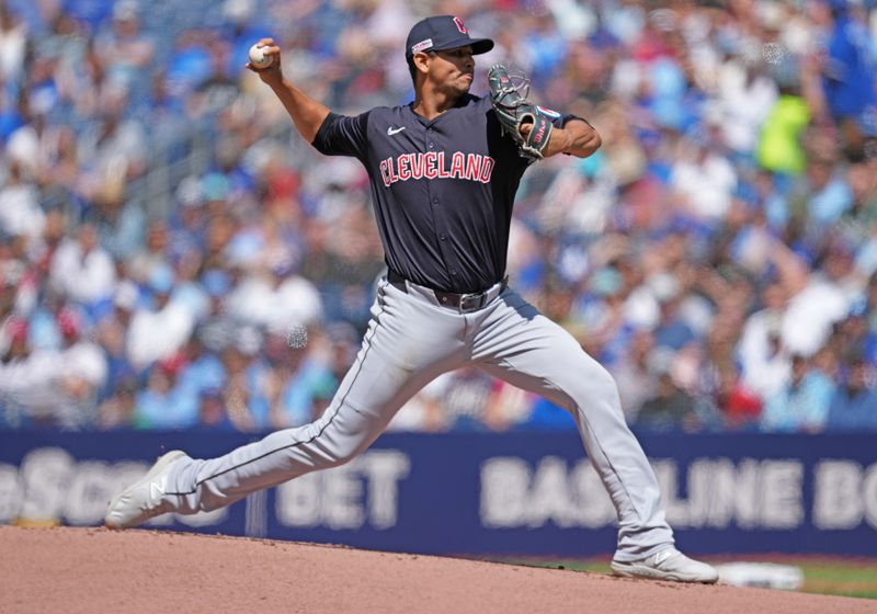 Jun 15, 2024; Toronto, Ontario, CAN; Cleveland Guardians starting pitcher Carlos Carrasco (59) throws a pitch against the Toronto Blue Jays during the first inning at Rogers Centre. Mandatory Credit: Nick Turchiaro-USA TODAY Sports