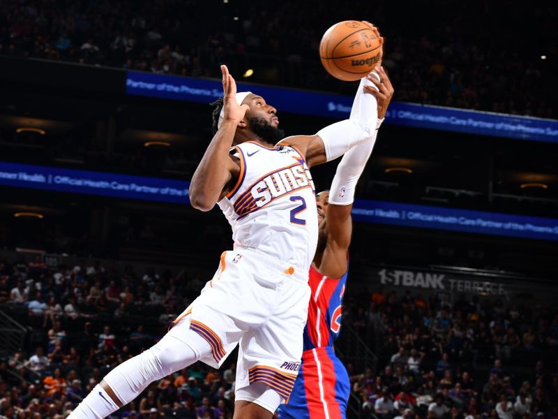 PHOENIX, AZ - OCTOBER 11: Josh Okogie #2 of the Phoenix Suns rebounds the ball during the game against the Detroit Pistons during a NBA preseason game on October 11, 2024 at Footprint Center in Phoenix, Arizona. NOTE TO USER: User expressly acknowledges and agrees that, by downloading and or using this photograph, user is consenting to the terms and conditions of the Getty Images License Agreement. Mandatory Copyright Notice: Copyright 2024 NBAE (Photo by Barry Gossage/NBAE via Getty Images)