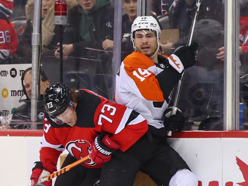 Dec 19, 2023; Newark, New Jersey, USA; Philadelphia Flyers right wing Garnet Hathaway (19) is hit by New Jersey Devils right wing Tyler Toffoli (73) during the third period at Prudential Center. Mandatory Credit: Ed Mulholland-USA TODAY Sports