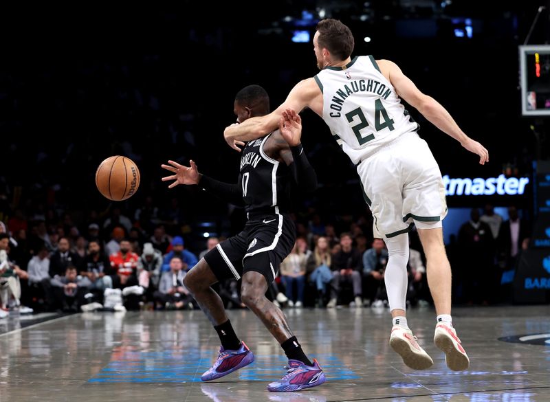 NEW YORK, NEW YORK - OCTOBER 27: Pat Connaughton #24 of the Milwaukee Bucks fouls Dennis Schroder #17 of the Brooklyn Nets during the fourth quarter at Barclays Center on October 27, 2024 in the Brooklyn borough of New York City. (Photo by Luke Hales/Getty Images)