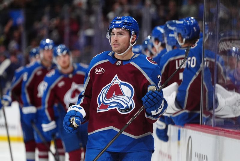 Oct 18, 2024; Denver, Colorado, USA; Colorado Avalanche center Ross Colton (20) celebrates his third period goal against the Anaheim Ducks at Ball Arena. Mandatory Credit: Ron Chenoy-Imagn Images