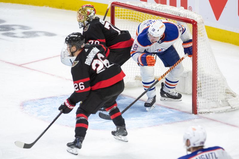 Mar 24, 2024; Ottawa, Ontario, CAN; Edmonton Oilers left wing Zach Hyman (18) ends up in the net in a play during the third period against the Ottawa Senators at the Canadian Tire Centre. Mandatory Credit: Marc DesRosiers-USA TODAY Sports