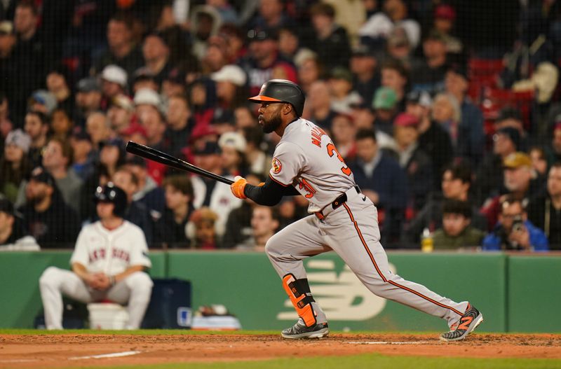 Apr 10, 2024; Boston, Massachusetts, USA;Baltimore Orioles outfielder Cedric Mullins (31) hits a single to right field against the Boston Red Sox in the sixth inning at Fenway Park. Mandatory Credit: David Butler II-USA TODAY Sports