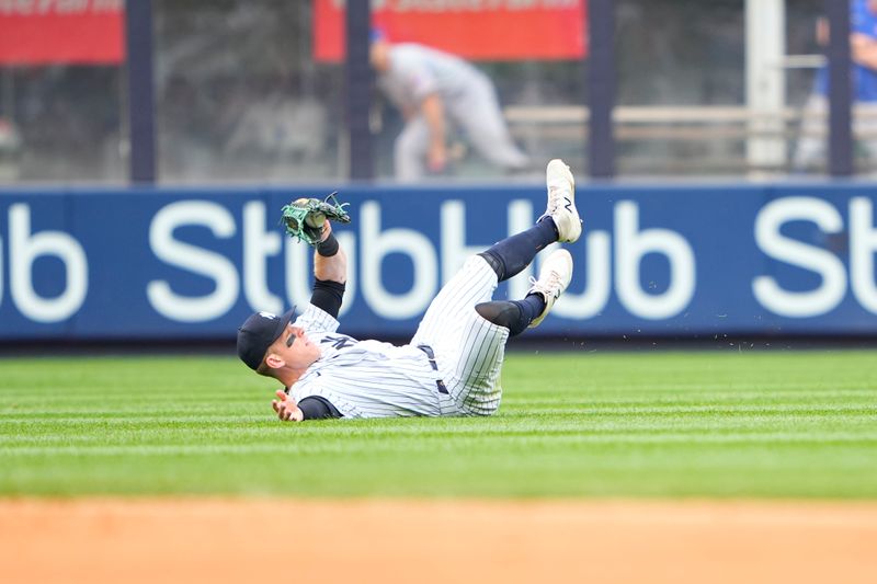 Jul 8, 2023; Bronx, New York, USA; New York Yankees center fielder Harrison Bader (22) catches a fly ball during the ninth inning at Yankee Stadium. Mandatory Credit: Gregory Fisher-USA TODAY Sports