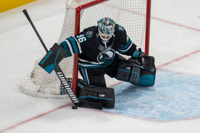 Feb 27, 2024; San Jose, California, USA;  San Jose Sharks goaltender Kaapo Kahkonen (36) makes a save against the New Jersey Devils during the third period at SAP Center at San Jose. Mandatory Credit: Neville E. Guard-USA TODAY Sports