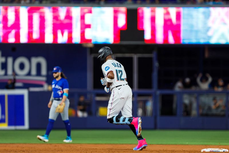 Jun 19, 2023; Miami, Florida, USA; Miami Marlins designated hitter Jorge Soler (12) circles the bases after hitting a two-run home run against the Toronto Blue Jays during the third inning at loanDepot Park. Mandatory Credit: Sam Navarro-USA TODAY Sports