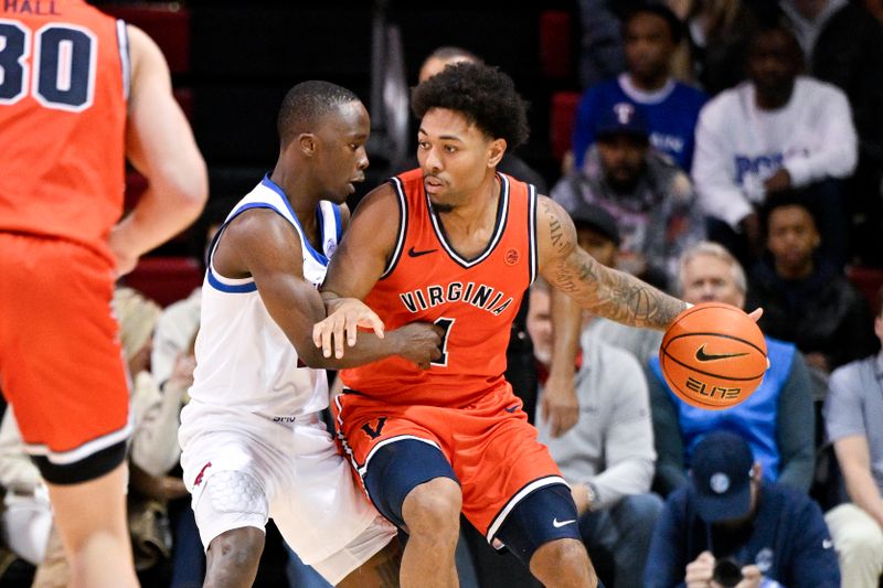 Jan 17, 2026; Dallas, Texas, USA; Virginia Cavaliers guard Malik Thomas (1) looks to move the ball past SMU Mustangs guard Boopie Miller (2) during the second half at Moody Coliseum. Mandatory Credit: Jerome Miron-Imagn Images
