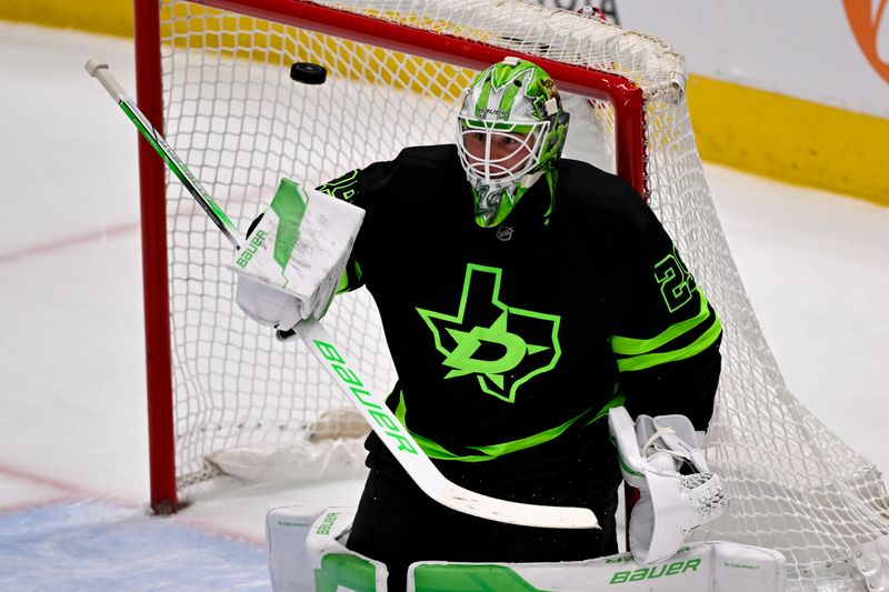 Apr 3, 2025; Dallas, Texas, USA; Dallas Stars goaltender Jake Oettinger (29) makes a save on a Nashville Predators shot during the first period at the American Airlines Center. Mandatory Credit: Jerome Miron-Imagn Images
