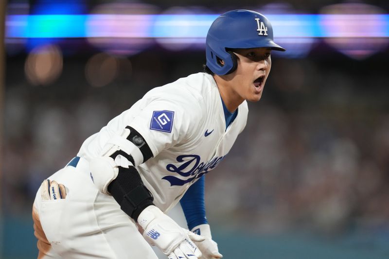 Aug 20, 2024; Los Angeles, California, USA; Los Angeles Dodgers designated hitter Shohei Ohtani (17) reacts after hitting a triple in the third inning against the Seattle Mariners at Dodger Stadium. Mandatory Credit: Kirby Lee-USA TODAY Sports