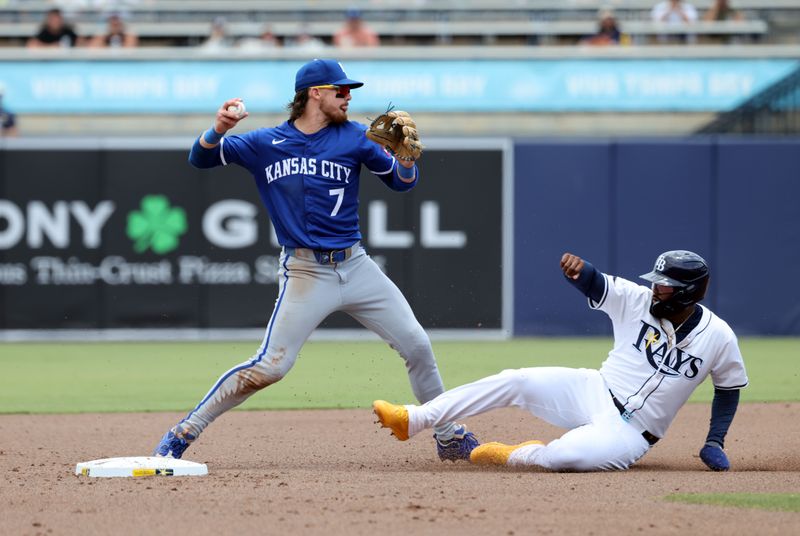 May 1, 2025; St. Petersburg, Florida, USA; Kansas City Royals shortstop Bobby Witt Jr. (7) forces out Tampa Bay Rays third base Junior Caminero (13) and throws the ball to first base during the second inning at George M. Steinbrenner Field. Mandatory Credit: Kim Klement Neitzel-Imagn Images