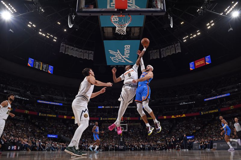 DENVER, CO - OCTOBER 24: Peyton Watson #8 of the Denver Nuggets rebounds the ball during the game against the Oklahoma City Thunder on October 24, 2024 at Ball Arena in Denver, Colorado. NOTE TO USER: User expressly acknowledges and agrees that, by downloading and/or using this Photograph, user is consenting to the terms and conditions of the Getty Images License Agreement. Mandatory Copyright Notice: Copyright 2024 NBAE (Photo by Garrett Ellwood/NBAE via Getty Images)