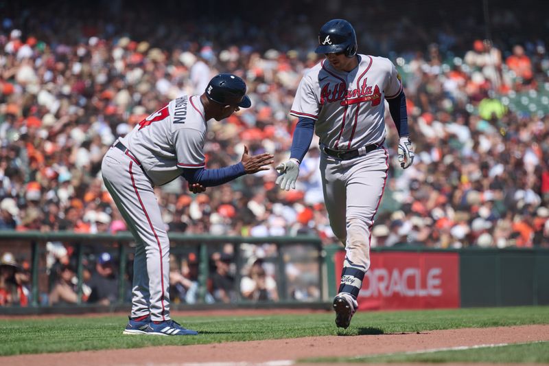 Aug 26, 2023; San Francisco, California, USA; Atlanta Braves infielder Austin Riley (27) shakes hands with third base coach Ron Washington (37) after hitting a home run against San Francisco Giants during the fifth inning at Oracle Park. Mandatory Credit: Robert Edwards-USA TODAY Sports