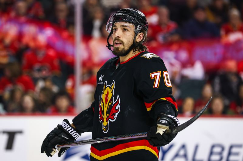 Dec 31, 2024; Calgary, Alberta, CAN; Calgary Flames left wing Ryan Lomberg (70) against the Vancouver Canucks during the second period at Scotiabank Saddledome. Mandatory Credit: Sergei Belski-Imagn Images