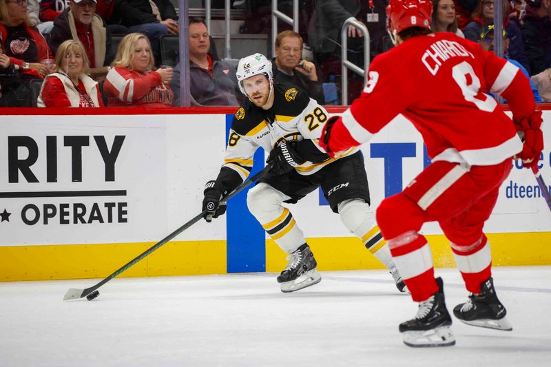 Nov 23, 2024; Detroit, Michigan, USA; Boston Bruins center Elias Lindholm (28) handles the puck during the first period of the game against the Detroit Red Wings at Little Caesars Arena. Mandatory Credit: Brian Bradshaw Sevald-Imagn Images