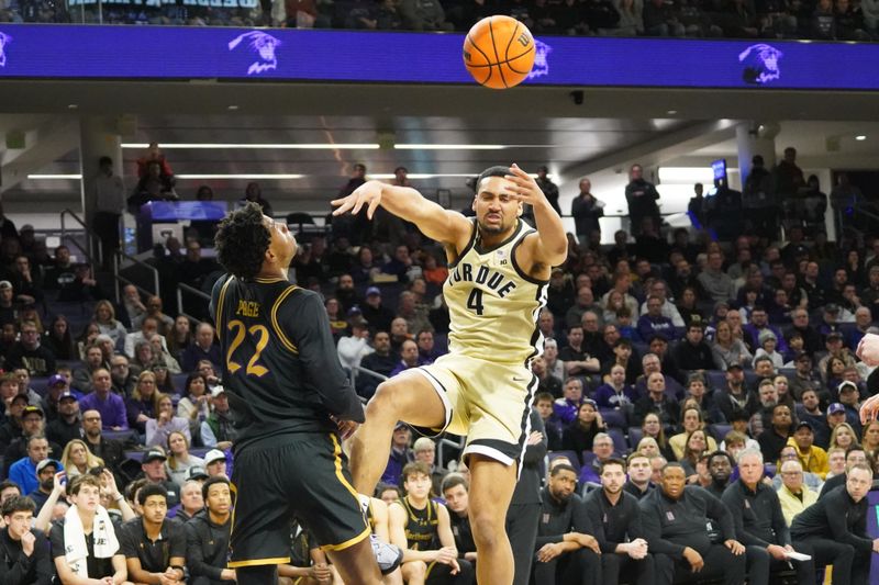 Mar 4, 2026; Evanston, Illinois, USA; Northwestern Wildcats forward Arrinten Page (22) defends Purdue Boilermakers forward Trey Kaufman-Renn (4) during the first half at Welsh-Ryan Arena. Mandatory Credit: David Banks-Imagn Images