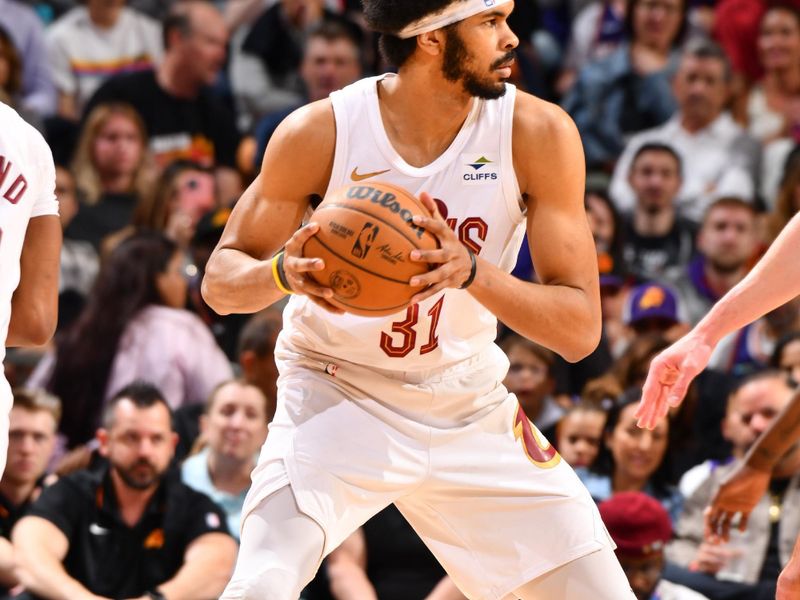 PHOENIX, AZ - APRIL 3:  Jarrett Allen #31 of the Cleveland Cavaliers handles the ball during the game  on April 3, 2024 at Footprint Center in Phoenix, Arizona. NOTE TO USER: User expressly acknowledges and agrees that, by downloading and or using this photograph, user is consenting to the terms and conditions of the Getty Images License Agreement. Mandatory Copyright Notice: Copyright 2024 NBAE (Photo by Barry Gossage/NBAE via Getty Images)