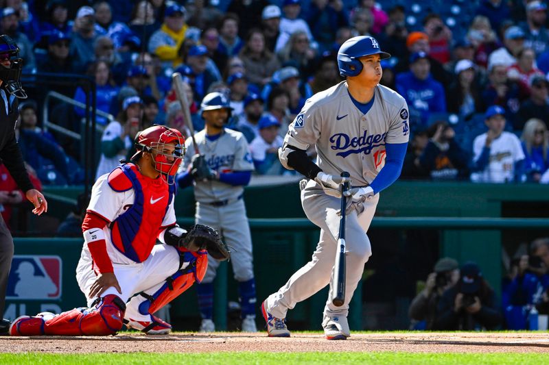 Apr 9, 2025; Washington, District of Columbia, USA; Los Angeles Dodgers two-way player Shohei Ohtani (17) singles against the Washington Nationals during the first inning at Nationals Park. Mandatory Credit: Brad Mills-Imagn Images