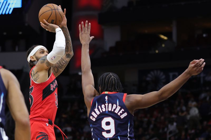 HOUSTON, TEXAS - FEBRUARY 03: Gary Trent Jr. #33 of the Toronto Raptors puts up a basket over Josh Christopher #9 of the Houston Rockets during the second half at Toyota Center on February 03, 2023 in Houston, Texas. NOTE TO USER: User expressly acknowledges and agrees that, by downloading and or using this photograph, User is consenting to the terms and conditions of the Getty Images License Agreement. (Photo by Carmen Mandato/Getty Images)